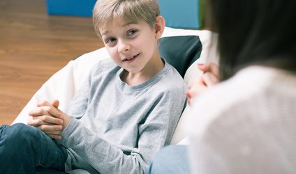 Happy boy having hypnotherapy